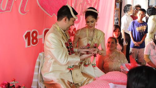 Exchanging rings at our traditional Thai wedding