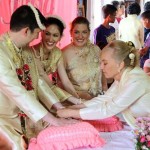 Mom String tying ceremony at our Thai wedding