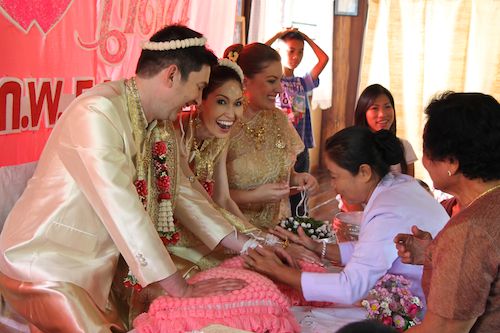 String tying ceremony at our Thai wedding