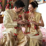 Breaking the strings at the string tying ceremony at our Thai wedding