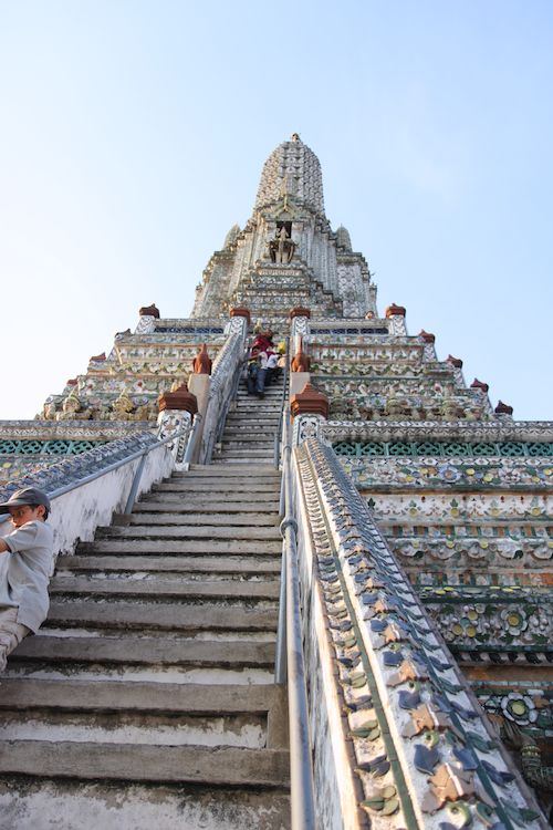 Climbing the stupa of temple in Bangkok, Thailand