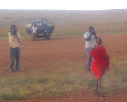 Maasai meeting bush plane in Masai Mara